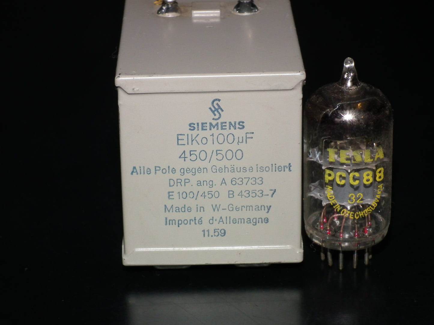 Siemens Klangfilm Electrolytic capacitor 100uF 500V Glass end seal 50s