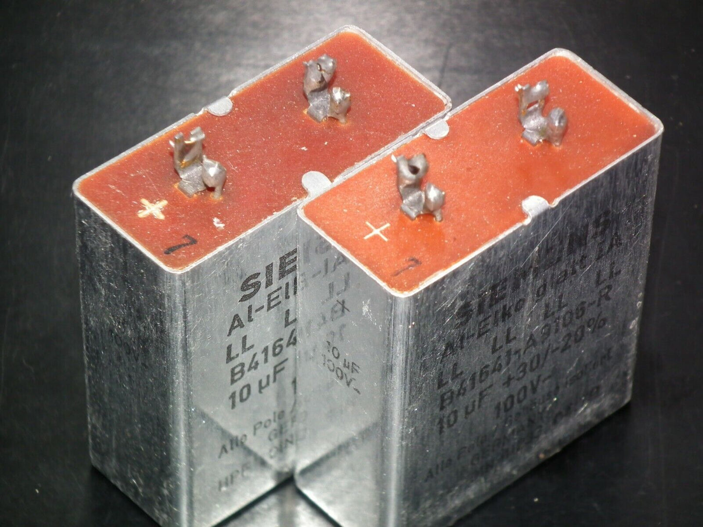 Two vintage Siemens electrolytic capacitors 10uF/100V Klangfilm West Germany 70s