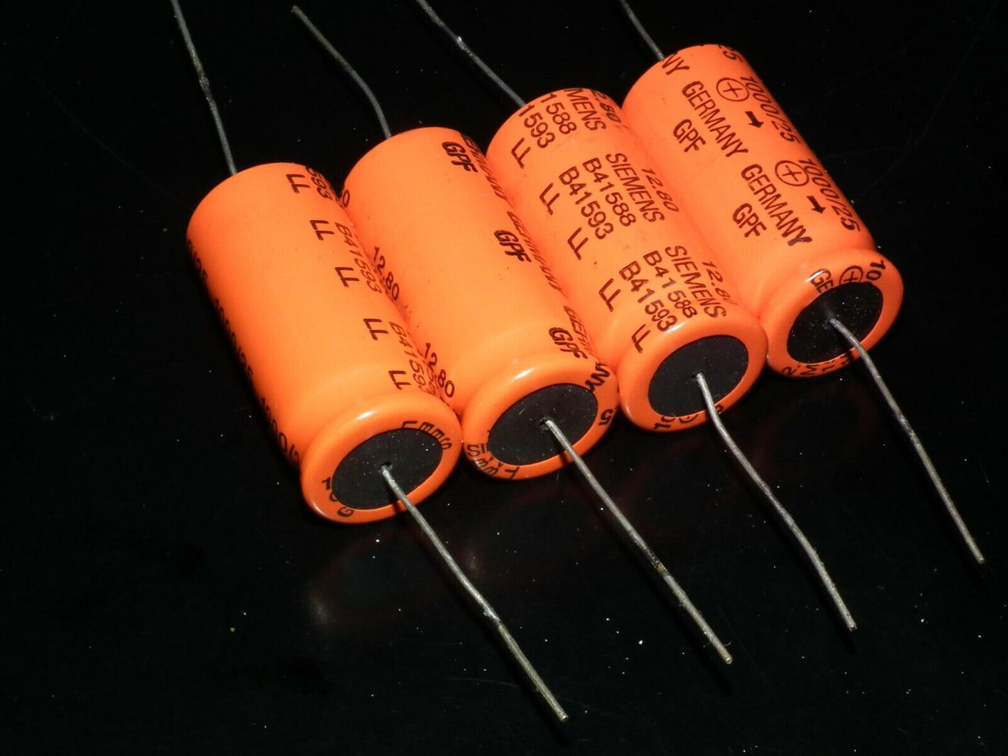 Four vintage NOS electrolytic capacitors 1000uF 25V Siemens W Germany Orange Can